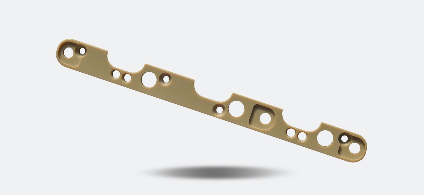 Precision micro-machined engineering-plastic part (12)